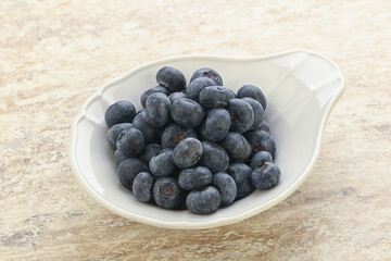 Sweet ripe blueberry heap in the bowl