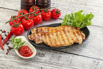 Grilled pork steak with ketchup