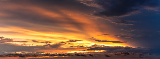 Fototapeta na wymiar Stormy Sunset Spectacle: Nature's Drama Adorns the Evening Skyline