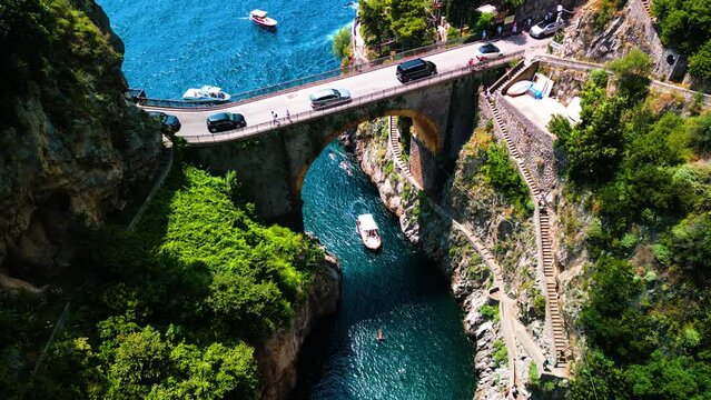 Aerial drone view of  Fjord of Furore. The azure waters, cliffs and famous bridge in Amalfi coast, Italy