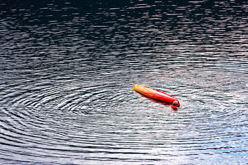 Kayaking on a blue lake. Tourist kayaking on a blue lake. Aerial or drone view.