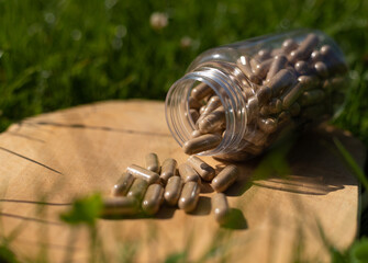 Jar with ashwagandha pills, body supplementation, energy and immunity, taking adaptogens