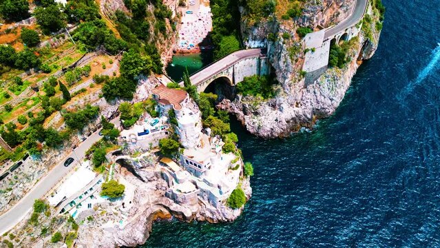 Drone aerial view of  Fjord of Furore in Italy . Azure waters, cliffs, famous bridge at Amalfi coast