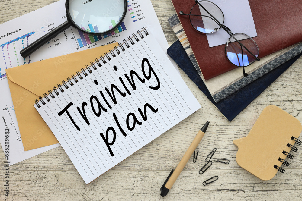 Poster training plan text on the page. notebook with a spring on the envelope