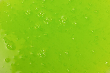 Green slime toy as a background.