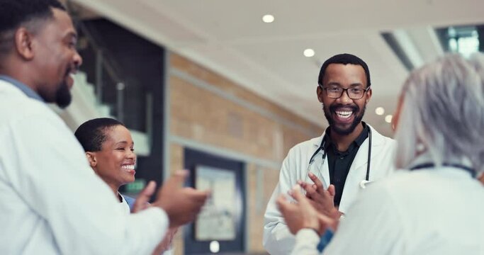 Healthcare, high five and applause with a team of doctors in the hospital for success or support in medicine. Goals, target and motivation with a professional medical group in a clinic for health