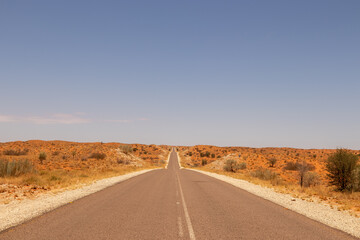 Fototapeta na wymiar The long, straight, tarred road from Upington to the Kgalagadi Transfrontier Park, South Africa
