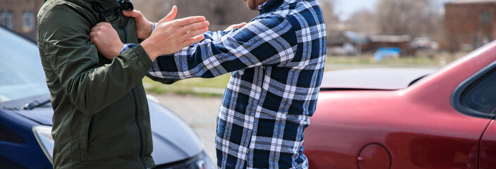 fighting men with car accident