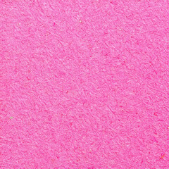 Glittery pink square shaped background with texture and space to write your text 