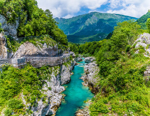 Fototapeta na wymiar A view up the Soca river from the Napoleon Bridge in Slovenia in summertime
