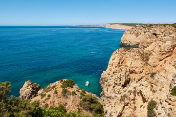 Fototapeta na wymiar Typical view of the Lagos coastline. Panoramic view of the Algarve shore, Portugal