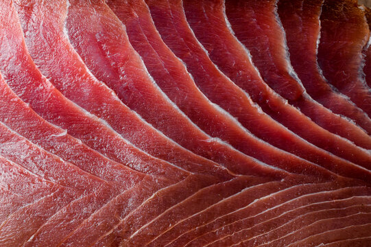 Appetizing fresh sliced bluefin tuna raw meat texture. Close-up. Macro photo