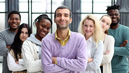 Group of business people standing at the window of a modern office