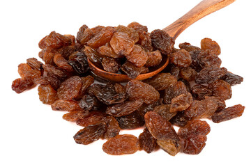 Spoon with raisins on a bunch of raisins over a white background.