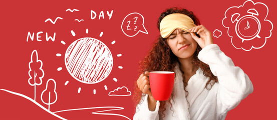 Displeased young African-American woman with sleep mask and cup of coffee on red background