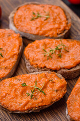 Delicious sandwich consisting of toast, red sauce with salt, spices and herbs