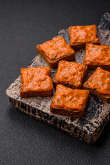 Delicious sandwich consisting of toast, red sauce with salt, spices and herbs