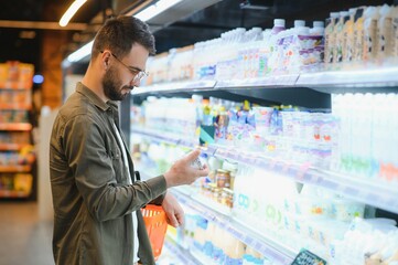 Smiling Male Customer Doing Grocery Shopping
