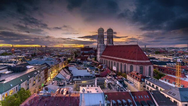 Munich skyline aerial view time lapse view of munich cathedral church frauenkriche in old town, munich germany night view.