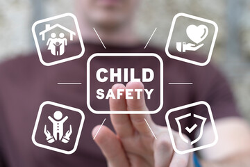 Man using virtual touch screen presses inscription: CHILD SAFETY. Concept of International...