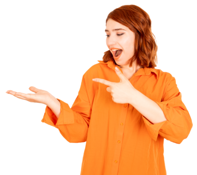 Pointing finger, excited young woman standing  transparent png image. Pointing finger. Happy face holding invisible product on her open palm. Looking to side away aside copy space for text, recommend.