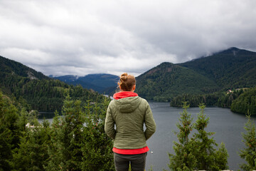 Fototapeta na wymiar beautiful lake surrounded by green fir trees