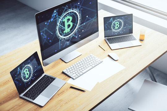 Modern computer display with creative Bitcoin symbol hologram. Mining and blockchain concept. 3D Rendering