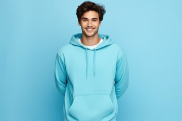Fototapeta premium Portrait of a young fictional man smiling. Isolated on a plain colored background. Generative AI.