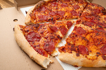 Pepperoni Pizza with Pickled Hot Jalapeno Peppers in Cardboard Delivery Box, Salami Pizza