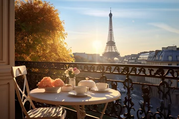 Fototapete Eiffelturm Delicious breakfast table french on a balcony in the morning sunlight. Beautiful view on the Eiffeltower. cozy romantic view in Paris