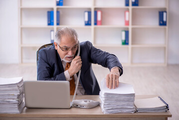 Old male employee and too much work in the office
