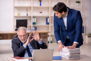 Two male colleagues working in the office