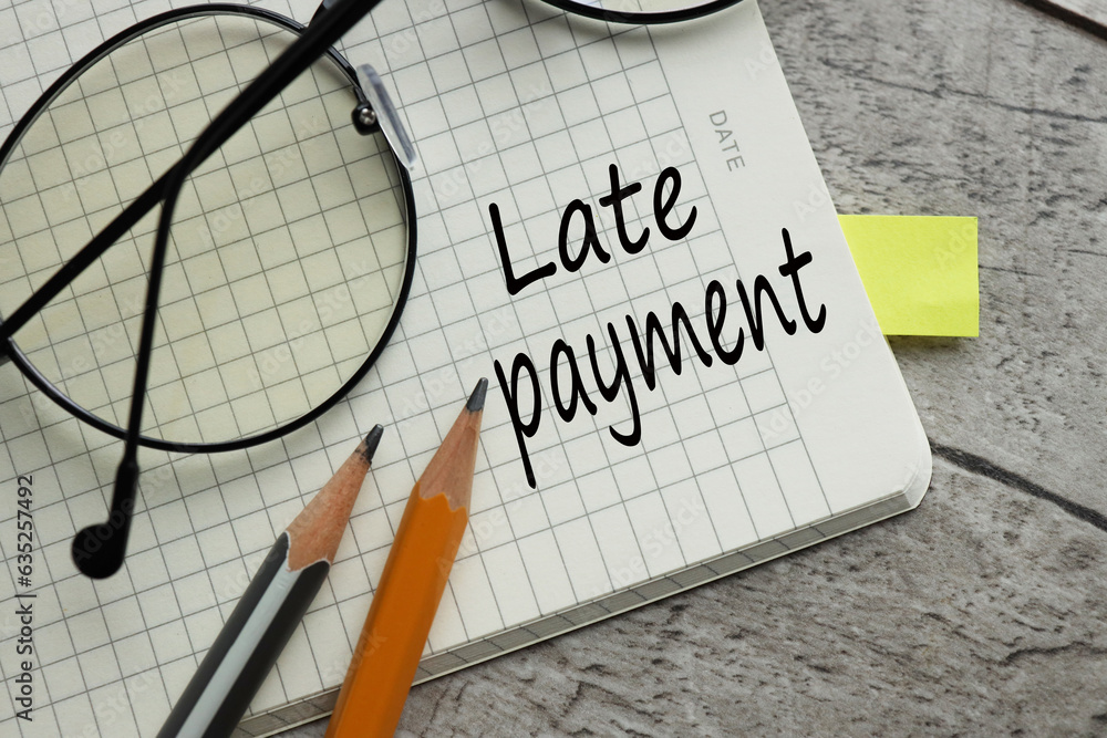 Poster late payment. business concept page of a notebook with text. words