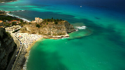 Fototapeta na wymiar Aerial view of famous Italian town Tropea with azure sea and colorful houses on cliffs