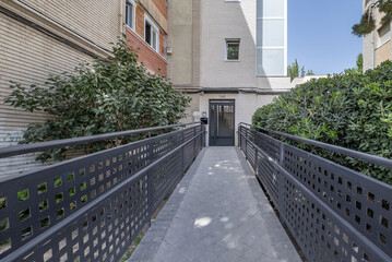 Fenced walkway with metal railings