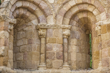 Fototapeta na wymiar Stone wall of an old Romanesque church