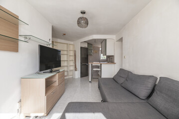 Living room furnished with a gray fabric sofa with a chaise longue