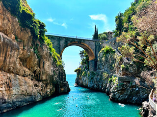Hidden beauty of Furore bridge , Amalfi coast in Italy. Famous fjord-like coastline and vibrant houses clinging to the cliffs offer a glimpse into the stunning uniqueness of this Italian village - obrazy, fototapety, plakaty