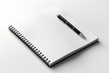 A notepad with a pen sitting on top of it. Digital image.