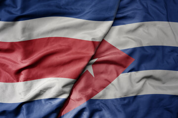 big waving realistic national colorful flag of chile and national flag of cuba .