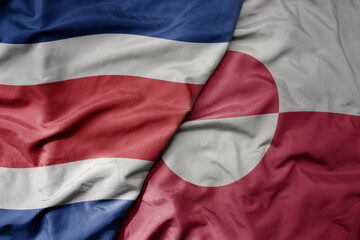 big waving realistic national colorful flag of chile and national flag of greenland .