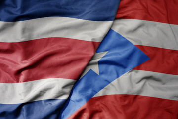 big waving realistic national colorful flag of chile and national flag of puerto rico .