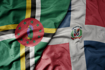 big waving realistic national colorful flag of dominica and national flag of dominican republic .