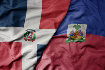 big waving realistic national colorful flag of cuba and national flag of haiti .