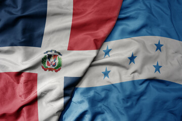big waving realistic national colorful flag of cuba and national flag of honduras .