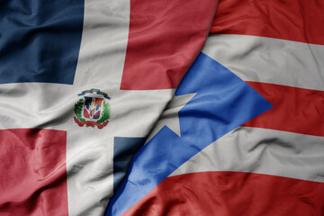 Fototapeta premium big waving realistic national colorful flag of cuba and national flag of puerto rico .