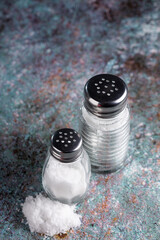 Glass salt shaker on the table.