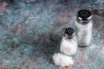 Glass salt shaker on the table.