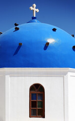 Blue domed chapel in Santorini, Greece