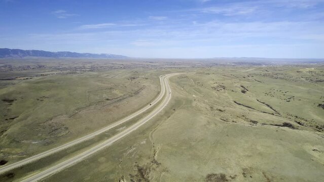 Interstate I-90 in Wyoming near Sheridan and Buffalo. Aerial drone video flying forward.